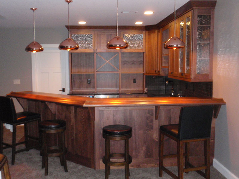 Here we have a beautiful wood bar comlete with plumbed sink and custom matched cabinets.