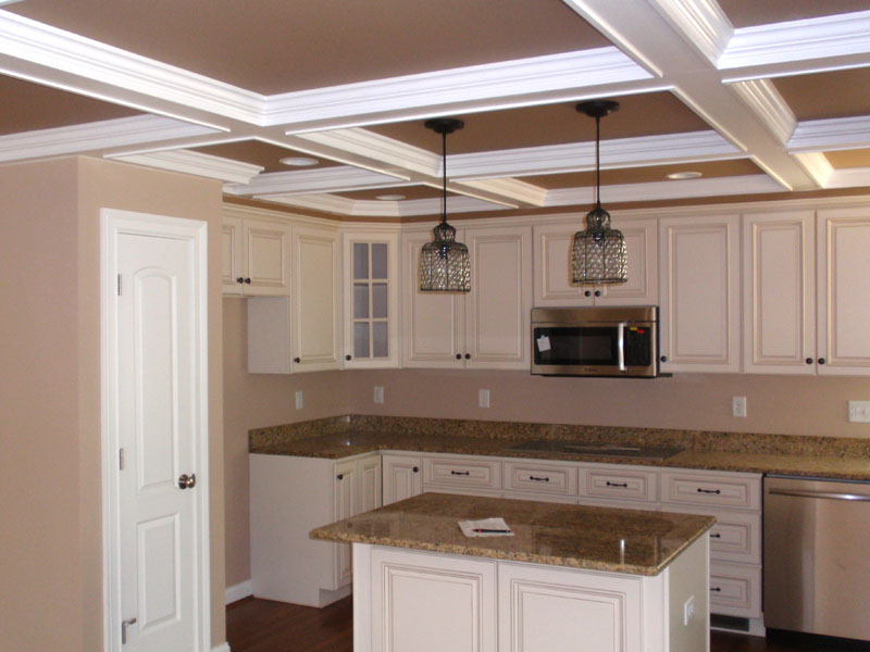 Beautiful white custom cabinets and granite countertops adorn this kitchen.