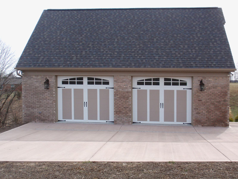 Beautiful Carriage style doors on this detached brick garage.